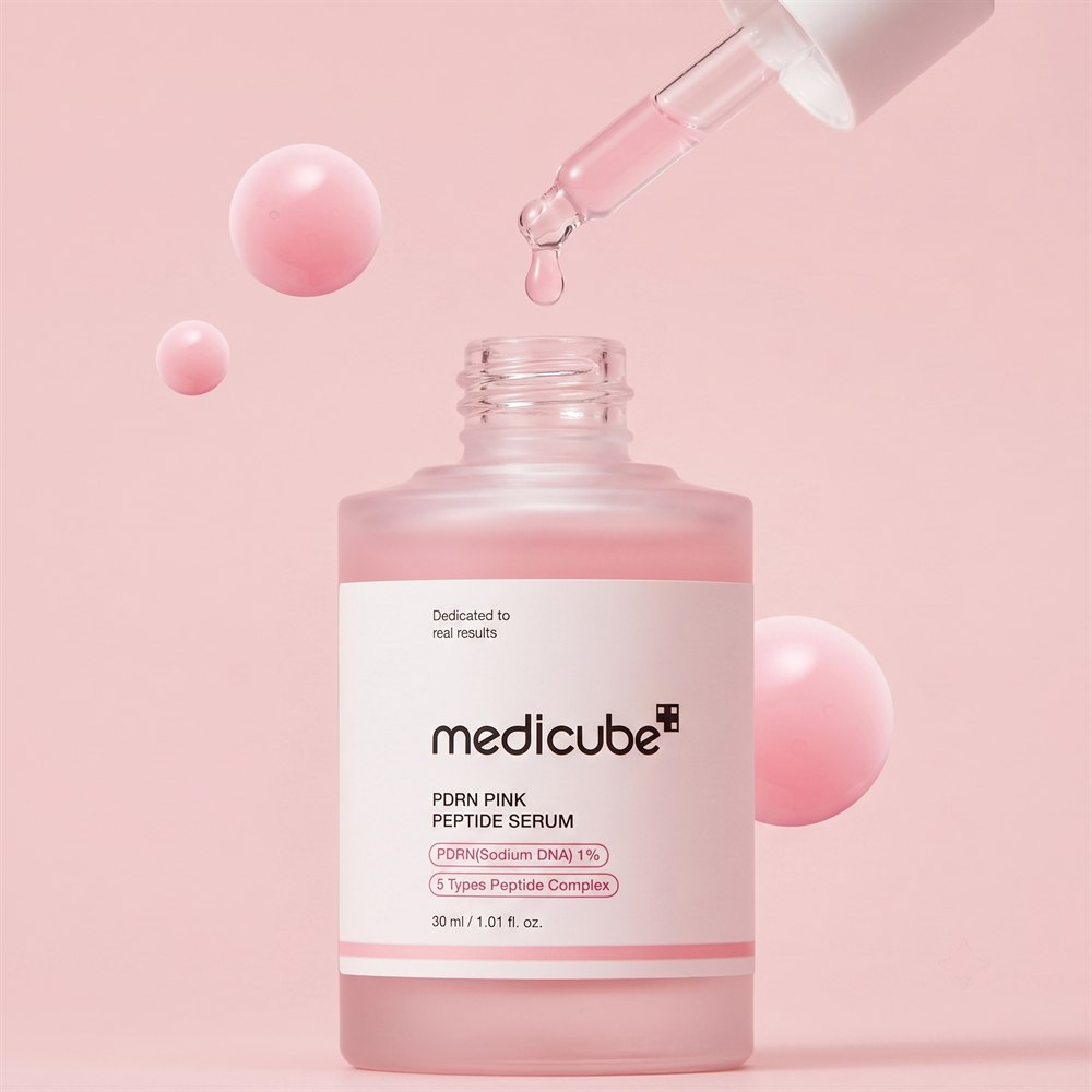 Gotero del serum con gota rosa